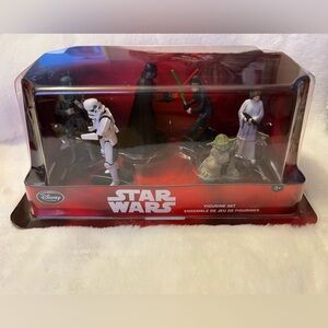 Six collectible Star Wars, Disney figurines.